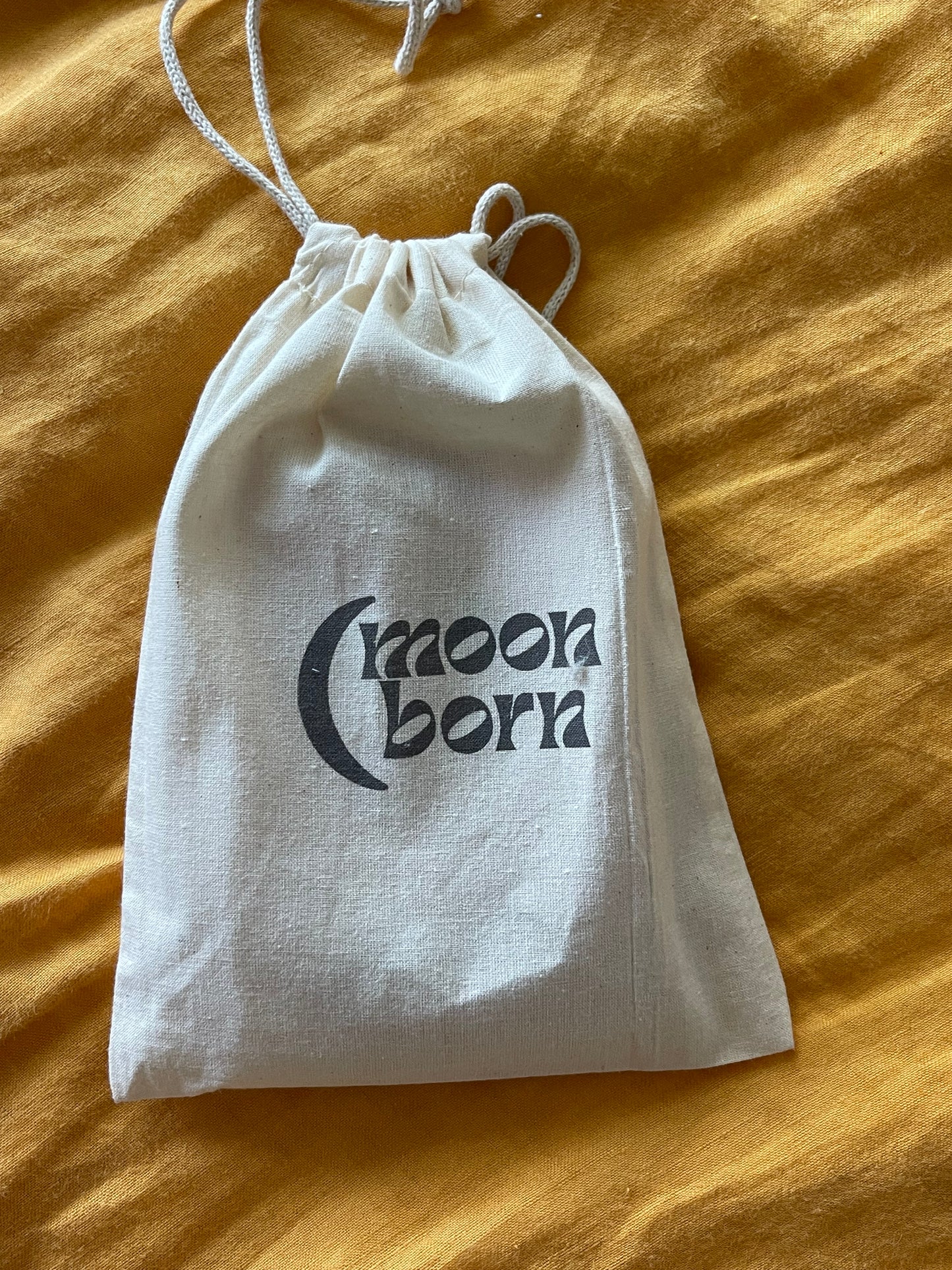 reusable organic cotton calico pouch with moon born branding