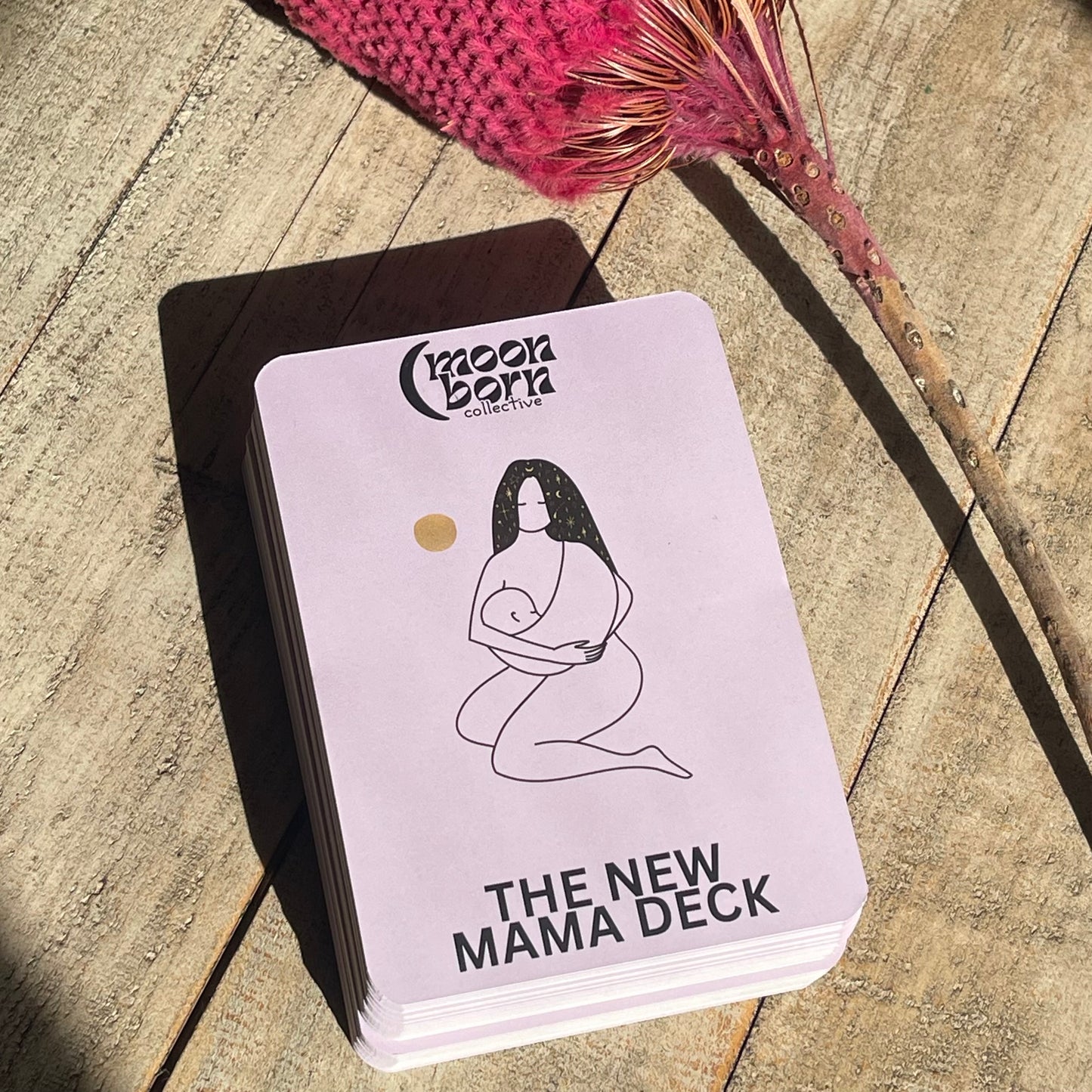 Stack of New Mama Deck affirmation cards with nature-inspired design